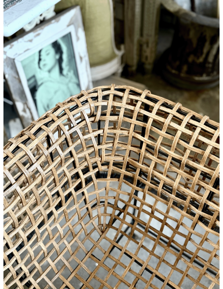 Poltrona in rattan intrecciato e ferro